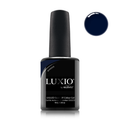Luxio gel polish bottle with a close-up of the indigo blue color on a white background