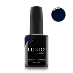 Luxio gel polish bottle with a close-up of the indigo blue color on a white background